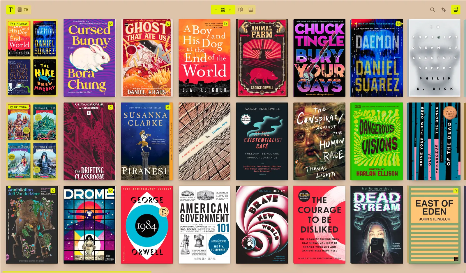 The Tomen library, a grid of book and comic covers, with view toggles and reading marks